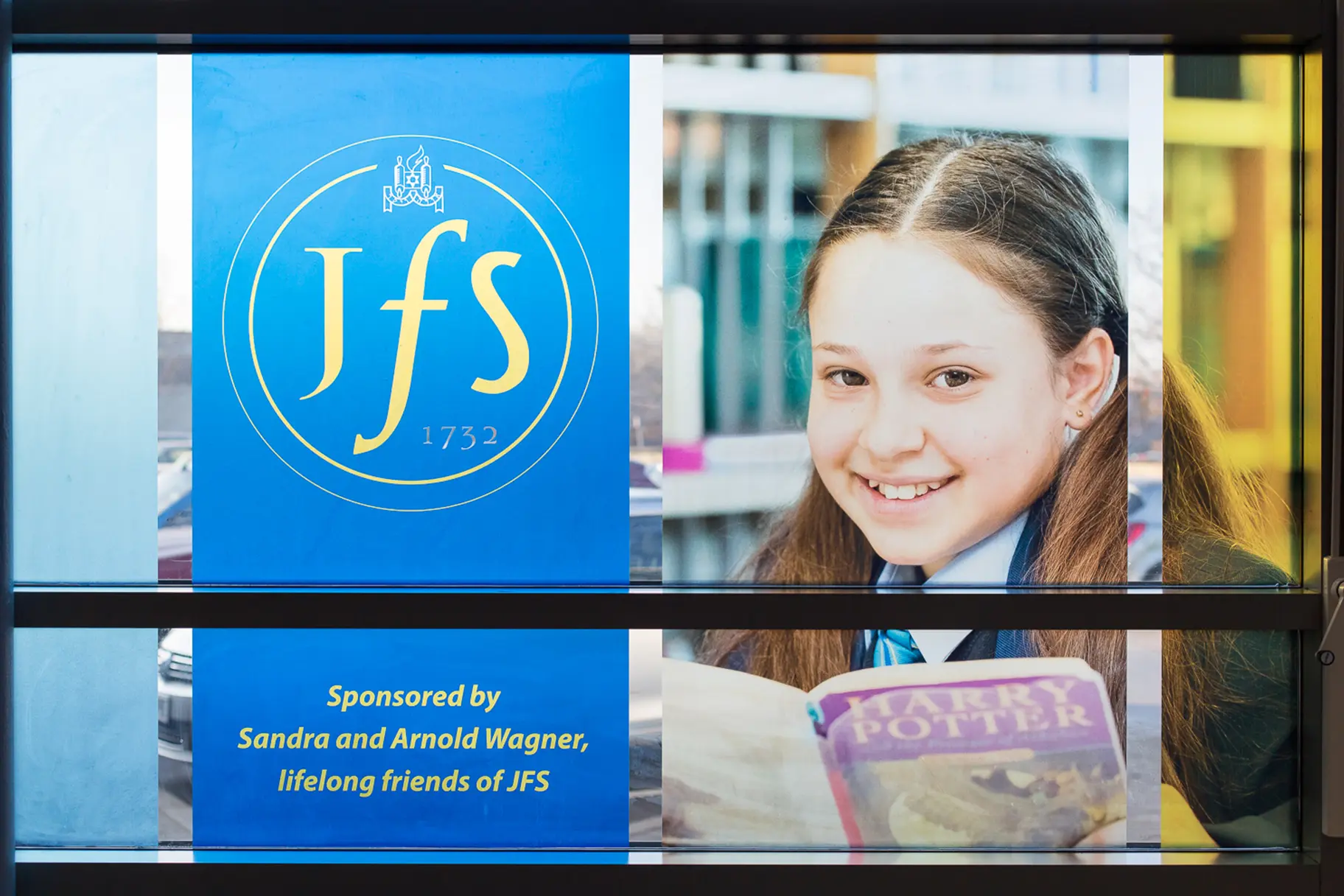 JFS School welcome window wall art featuring student photography