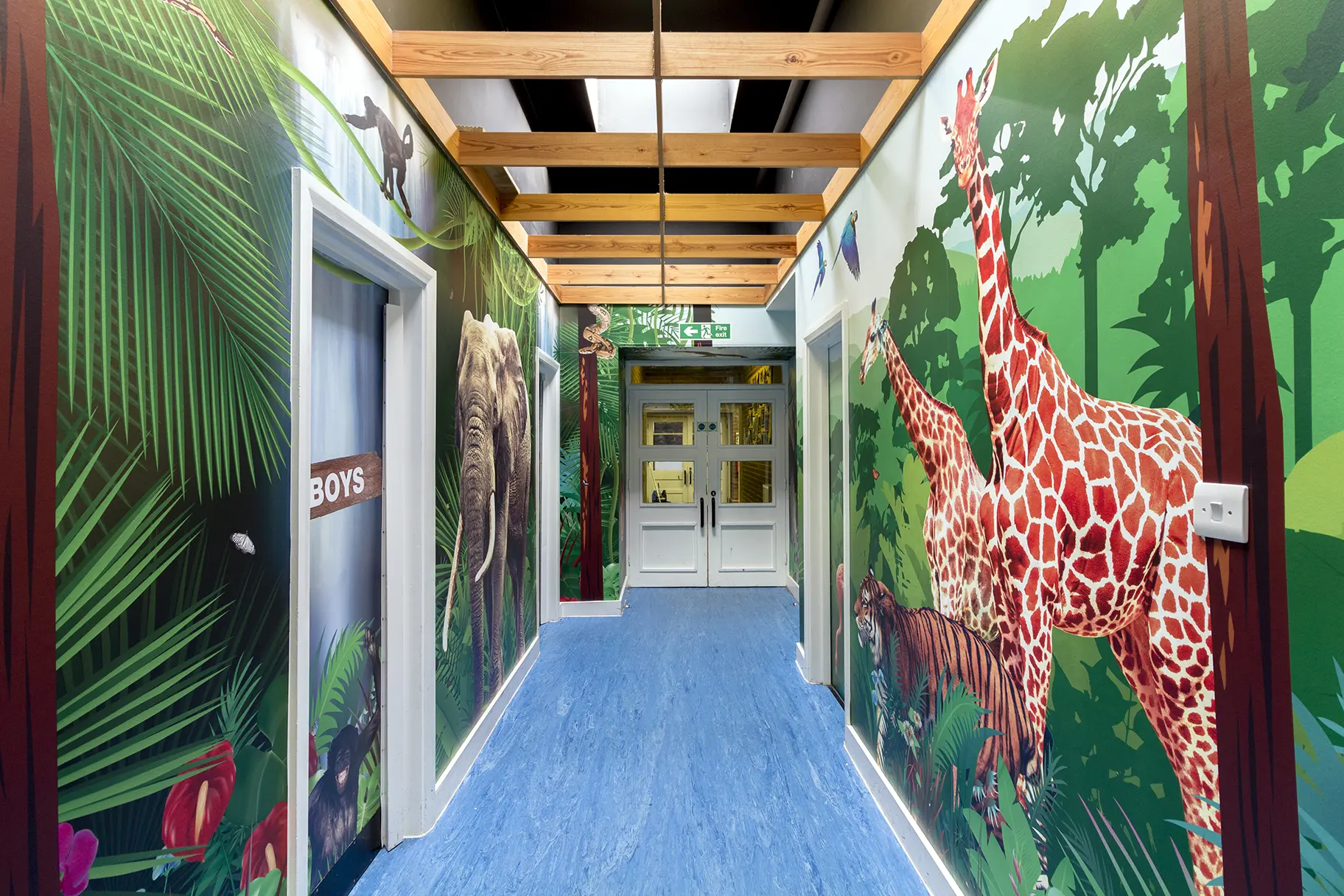Mottingham Primary School immersive wrap around themed corridor wall art
